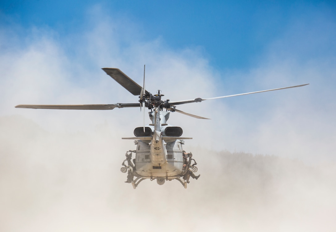 A UH-1Y Venom helicopter departs from a beach during a helocast exercise at Okinawa, Japan, July 25, 2018. U.S. Marines train to sharpen technical and tactical skills and enhance unit cohesion to ensure mission success. The Venom belongs to Marine Light Attack Helicopter Squadron 469, currently under the unit deployment program with Marine Aircraft Group 36, 1st Marine Aircraft Wing.