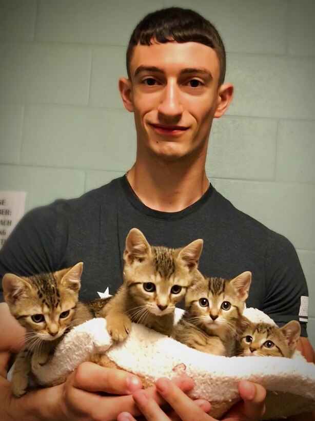 Corporal Steven Fiegura volunteers weekly at the Fredericksburg Society for the Prevention for Cruelty to Animals.