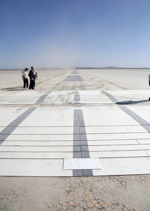 A C-5 Galaxy taxis across a series of ramps on Rogers Dry Lakebed here August 2 as part of the C-5�s Reliability Enhancement and Re-Engining Program. The dynamic tests are designed to evaluate the structural modes of the aircraft with newer CF6 jet engines installed.  (Photo by Jet Fabara)