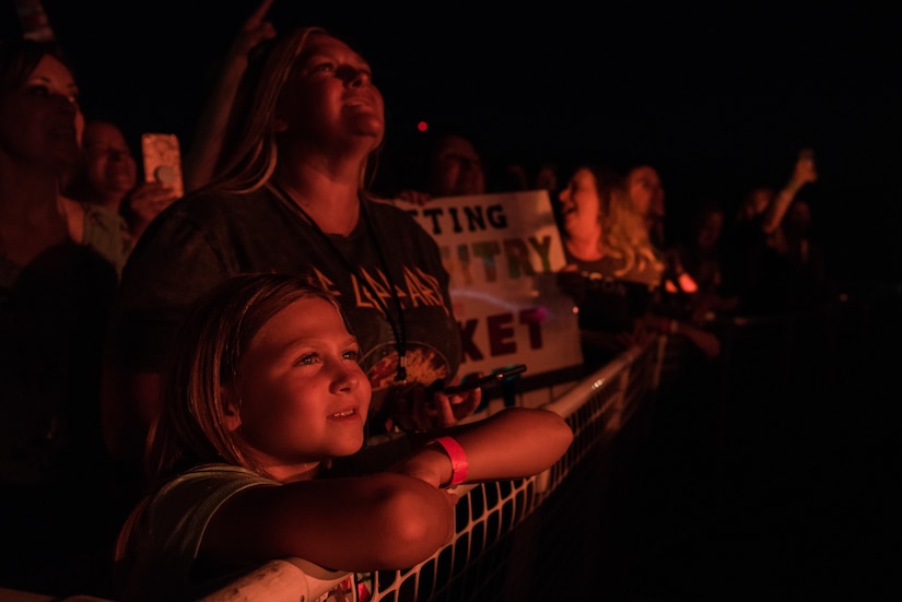 Event attendees watch Daughtry perform during their "Paying it Forward" concert at Joint Base Langley Eustis, Virginia, July 28, 2018.