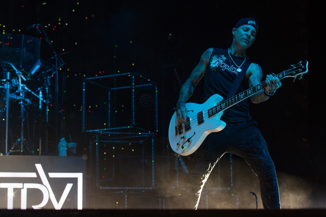 Josh Paul, bass guitarist, plays during the Daughtry's "Paying it Forward" concert at Joint Base Langley-Eustis, Virginia, July 28, 2018.