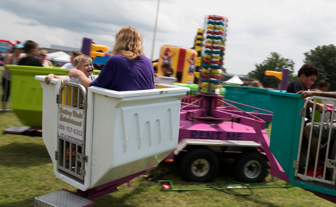 Fort Eustis Open House attendees partake in carnival rides as part of the installation's 100th Anniversary Celebration at Joint Base Langley Eustis, Virginia, July 28, 2018.