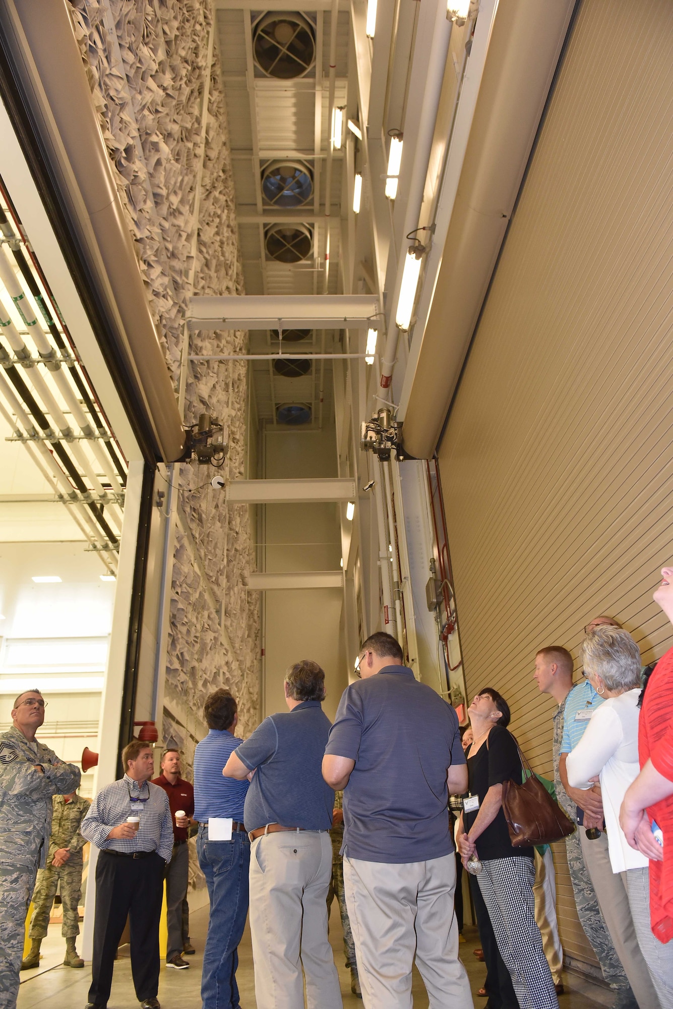 Civic leaders from Little Rock Air Force Base, Arkansas, look at a filtration system for a new hangar built for the Air Force’s newest weapon system, the KC-46 Pegasus July 27, 2018 at McConnell AFB, Kansas. The twenty civic leaders visited McConnell to learn more about the base’s intelligence and air refueling missions. (U.S. Air Force photo by Staff Sgt. David Bernal Del Agua)