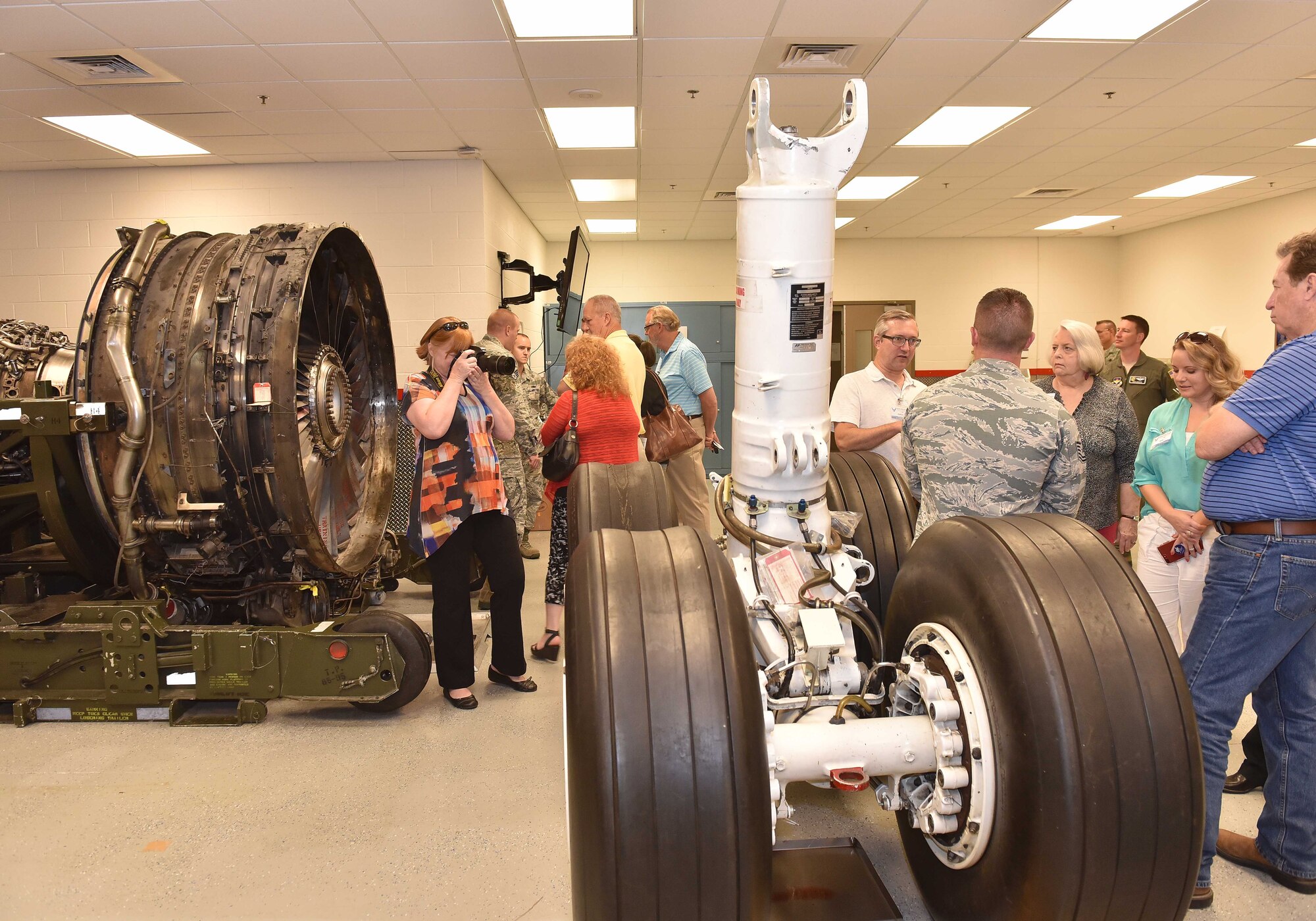 Civic leaders from Little Rock Air Force Base, Arkansas, tour a 22nd Maintenance Group maintenance qualification training program classroom July 27, 2018, at McConnell AFB, Kansas. The tour included mission briefings from three wing commanders, information on the upcoming KC-46 Pegasus, as well as a tour of a KC-135 Stratotanker. (U.S. Air Force photo by Staff Sgt. David Bernal Del Agua)
