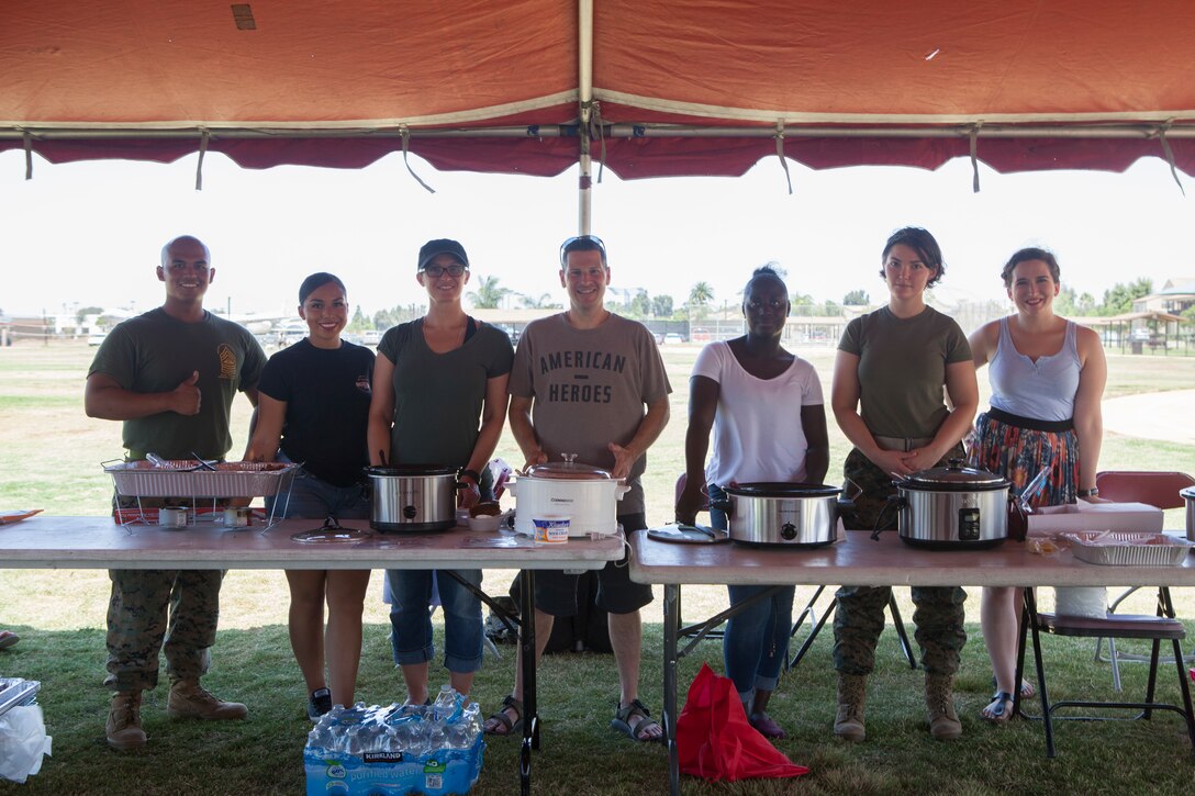 Participants prepare to serve their chili during the Headquarters and Headquarters Squadron “Chili Cook-Off and three point shootout” at Marine Corps Air Station Miramar, Calif., July 27.  The event was hosted by the H&HS as part of the monthly “Warrior Challenge” competition, bringing the unit together through various events throughout the year.