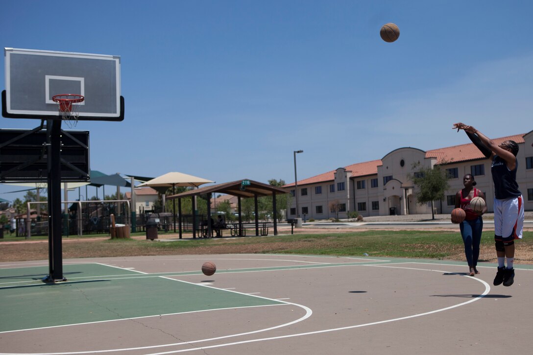 U.S. Marine De’Shynic Conner, legal assistant chief with Legal Services Support Team, shoots her final three shots during the Headquarters and Headquarters Squadron “Chili Cook-Off and three point shootout” at Marine Corps Air Station Miramar, Calif., July 27.  The event was hosted by the H&HS as part of the monthly “Warrior Challenge” competition, bringing the unit together through various events throughout the year.