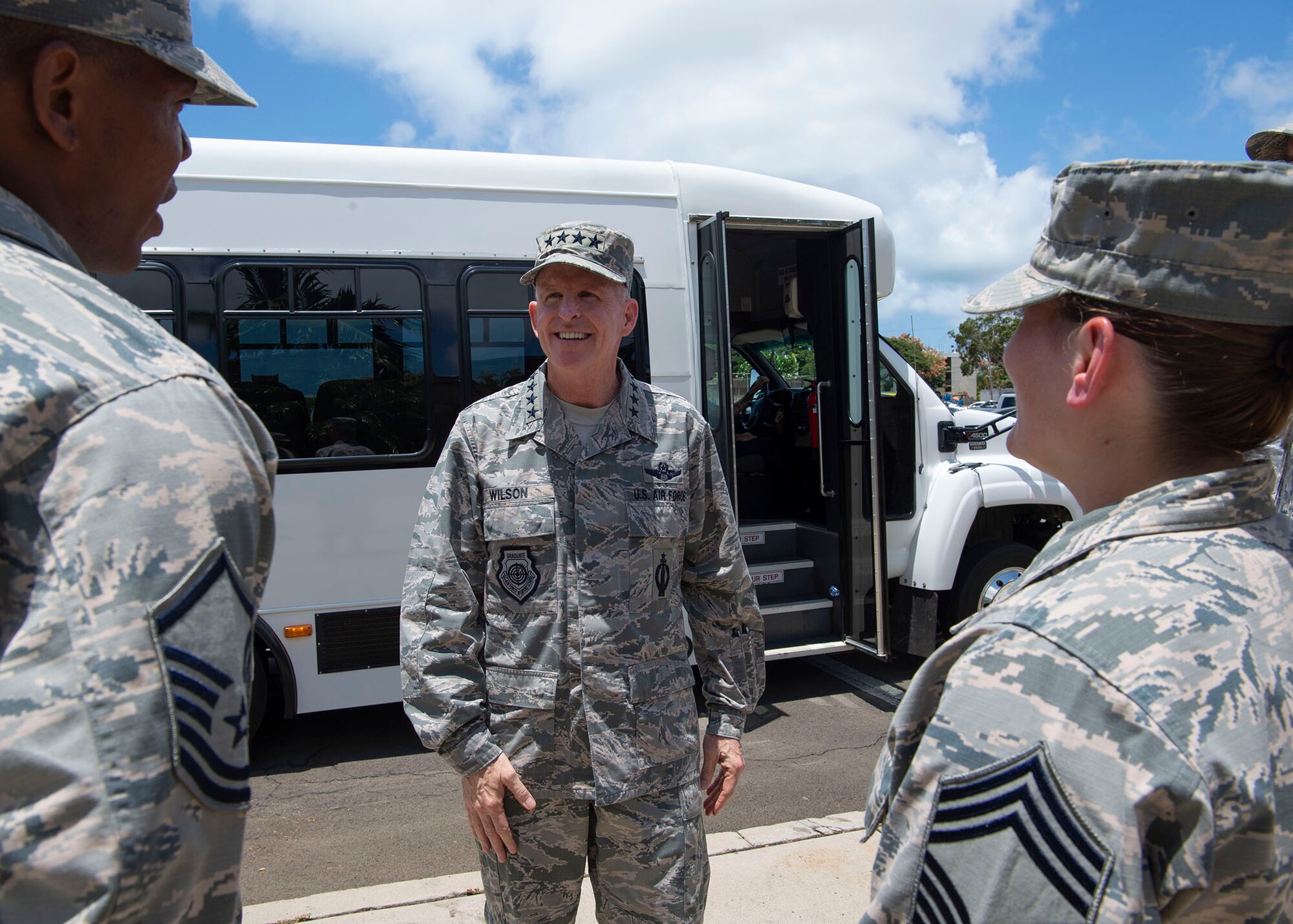 Master Sgt. Sheldon Grant, 647th Force Support Squadron food service section chief, and Chief Master Sgt. Katherine Kwarcinski, 647th FSS superintendent, greet Air Force Vice Chief of Staff Gen. Stephen W. Wilson at the Hale Aina Dining Facility, Joint Base Pearl Harbor-Hickam, Hawaii, July 26, 2018.  Wilson visited Airmen from around the 15th Wing after the Pacific Air Forces change of command ceremony. During his visit, Wilson had lunch with some of the chiefs, first sergeants and presidents of base private organizations to discuss challenges they have been faced with and reiterate the importance of modernization, readiness, innovation and revitalizing squadrons. (U.S. Air Force photo by Tech. Sgt. Heather Redman)