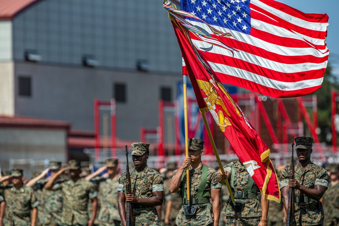 The I Marine Expeditionary Force colors and American flag are presented during the I MEF change of command ceremony July 30, 2018, at Camp Pendleton, California. During the ceremony, Lt. Gen. Lewis A. Craparotta relinquished command of I MEF to Lt. Gen. Joseph L. Osterman. (U.S. Marine Corps photo by Lance Cpl. Megan Brown)