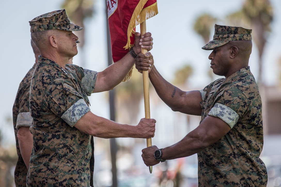 U.S. Marine Corps Lt. Gen. Lewis A. Craparotta, left, the outgoing commanding general of I Marine Expeditionary Force, receives the colors from Sgt. Maj. James K. Porterfield, the sergeant major of I MEF, during a change of command ceremony at Camp Pendleton, California, July 30, 2018. During the ceremony, Craparotta relinquished command of I MEF to Lt. Gen. Joseph L. Osterman. (U.S. Marine Corps photo by Lance Cpl. Dalton S. Swanbeck)