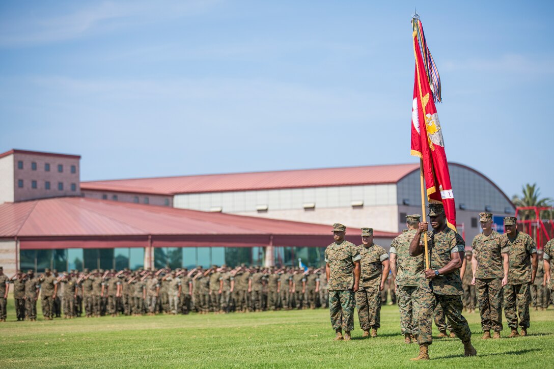 U.S. Marine Corps Sgt. Maj. James K. Porterfield, the sergeant major of I Marine Expeditionary Force, carries the colors during the I MEF change of command ceremony at Camp Pendleton, California, July 30, 2018. During the ceremony, Lt. Gen. Lewis A. Craparotta relinquished command of I MEF to Lt. Gen. Joseph L. Osterman. (U.S. Marine Corps photo by Lance Cpl. Dalton S. Swanbeck)