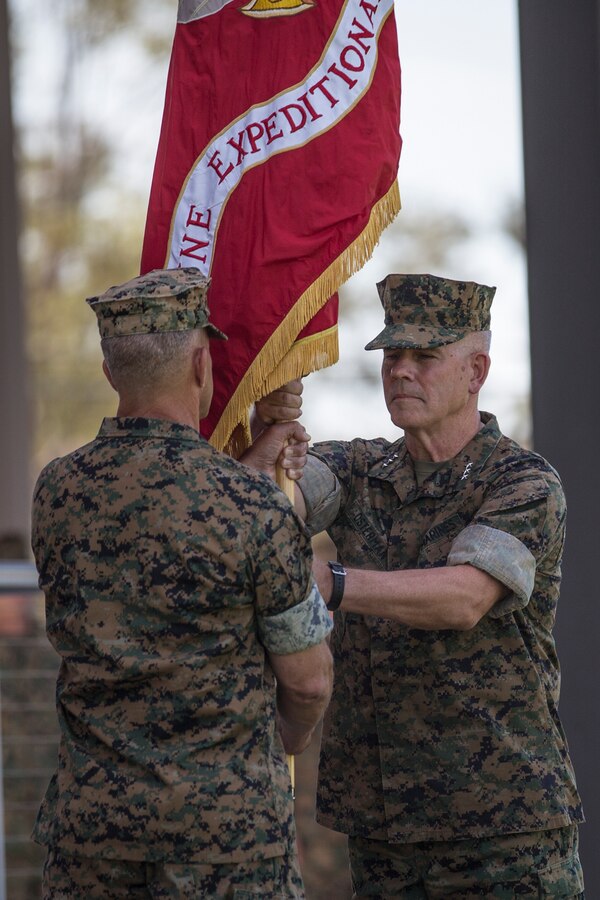 U.S. Marine Corps Lt. Gen. Lewis A. Craparotta, left, the outgoing commanding general of I Marine Expeditionary Force, transfers the colors to Lt. Gen. Joseph L. Osterman, the incoming commanding general, during a change of command ceremony at Camp Pendleton, California, July 30, 2018. During the ceremony, Craparotta relinquished command of I MEF to Osterman. (U.S. Marine Corps photo by Lance Cpl. Dalton S. Swanbeck)