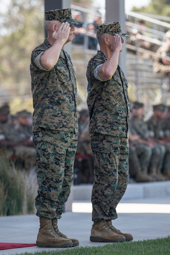 U.S. Marine Corps Lt. Gen. Joseph L. Osterman, left, the incoming commanding general of I Marine Expeditionary Force and Lt. Gen. Lewis A. Craparotta, the outgoing commanding general, salute for the pass in review during a change of command ceremony at Camp Pendleton, California, July 30, 2018. During the ceremony, Craparotta relinquished command of I MEF to Osterman. (U.S. Marine Corps photo by Lance Cpl. Dalton S. Swanbeck)