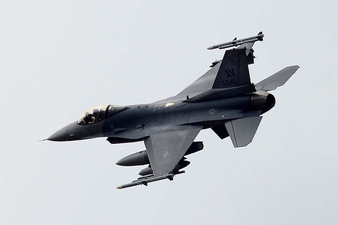 An F-16C Fighting Falcon flies over Royal Air Force Lakenheath.