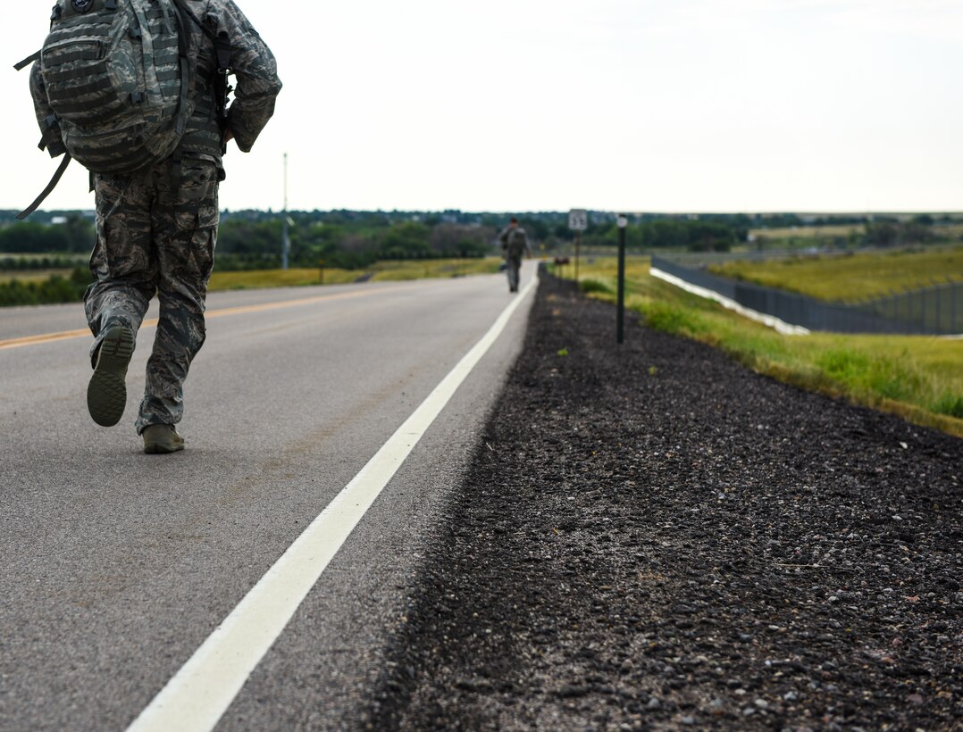 Senior Airman Nicholas Rauch, 460th Security Forces Squadron defender, runs during a ruck march in preparation for the Defenders Challenge July 27, 2018, on Buckley Air Force Base, Colorado. The ruck march consisted of carrying approximately 40 pounds of gear a total of four miles in under an hour. (U.S. Air Force photo by Airman 1st Class Michael D. Mathews)