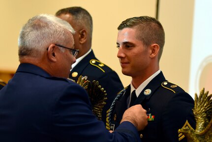 Air Force Maj. Gen. Anthony J. Carrelli, the adjutant general of the Pennsylvania National Guard, awards Army Sgt. Jordy Brewer, an infantryman with the Kentucky Army National Guard’s Company A, 1st Battalion, 149th Infantry Regiment, the top honor in the Noncommissioned Officer of the Year category in the 2018 Army National Guard Best Warrior Competition at Fort Indiantown Gap, Pennsylvania, July 27, 2018. Brewer beat out six other Soldiers from throughout the Army Guard to win the category, and will go on to compete in the 2018 all-Army Best Warrior Competition later in the year.