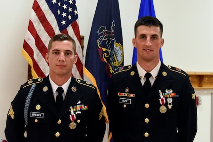 Army Sgt. Jordy Brewer (left), an infantryman with the Kentucky Army National Guard’s Company A, 1st Battalion, 149th Infantry Regiment, and Spc. Bailey Ruff, a tactical power generation specialist with the South Dakota Army Guard’s 842nd Engineer Company, pose for a picture after the closing ceremony of the 2018 Army National Guard Best Warrior Competition at Fort Indiantown Gap, Pennsylvania, July 27, 2018. Brewer and Ruff earned the titles of Army Guard Noncommissioned Officer and Soldier of the Year, respectively. Both will go on to compete in the 2018 all-Army Best Warrior Competition at Fort A.P. Hill, Virginia, later in the year.