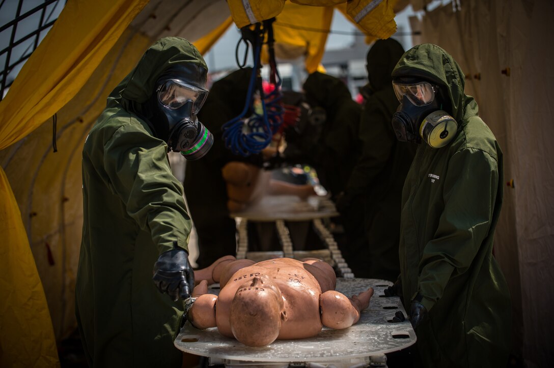 Decontamination Marines with Decontamination Platoon, Chemical Biological Incident Response Force decontaminate a simulated casualty during Exercise Chicago Response in Champaign, Illinois, July 24, 2018. This was the first time the active duty response force trained with Chicago-area first responders and served to establish a working relationship between CBIRF and the cities of Champaign and Chicago.