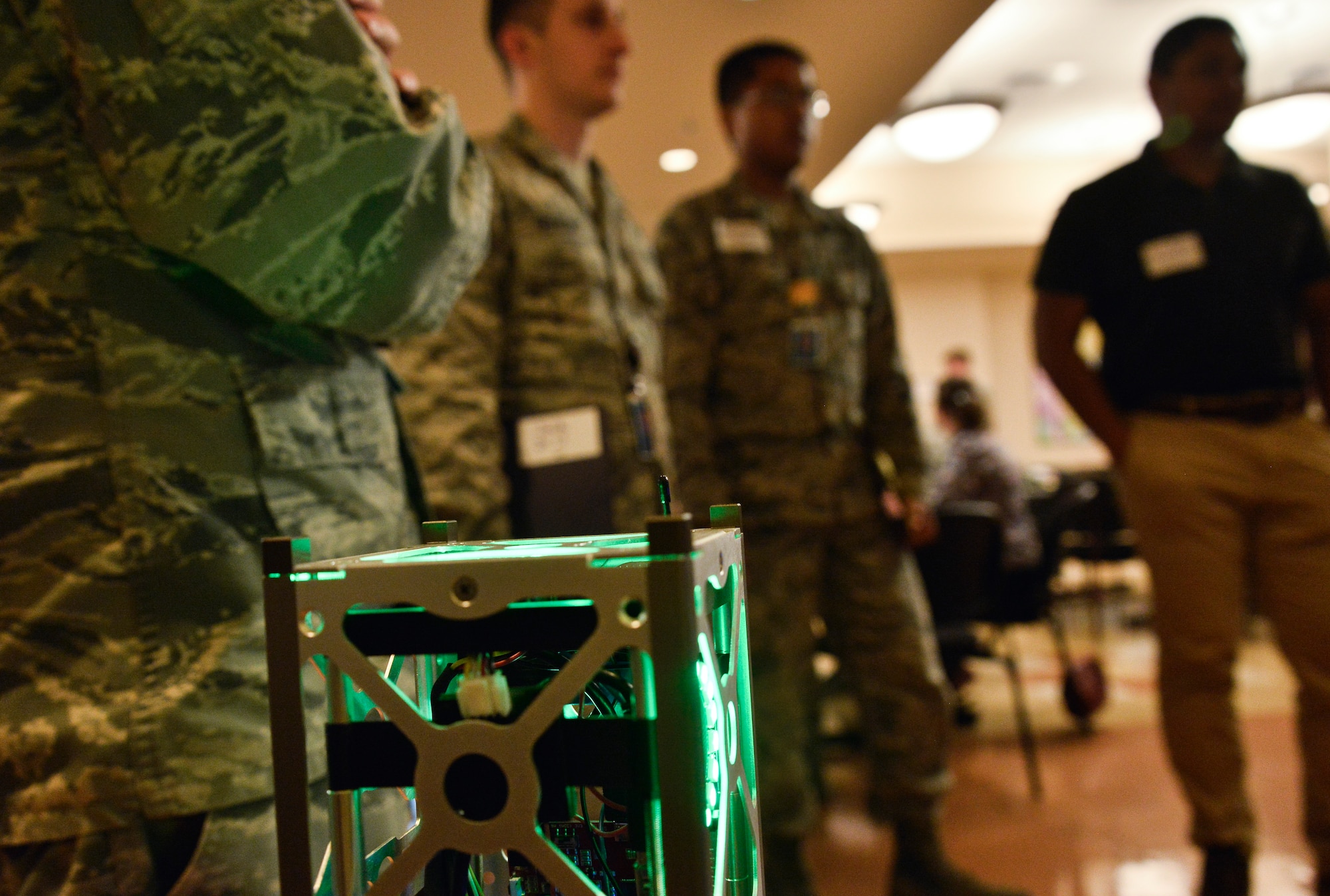 Airmen from the 70th Intelligence, Surveillance and Reconnaissance Wing learn about the CubeSat and how cyber and space operation are being done through cyber challenges July 24, 2018 at College Park, Maryland. This was the first summit which helped bring together more than 100 Airmen from across the wing to create a culture of innovation. (U.S. Air Force photo by Staff Sgt. Alexandre Montes)