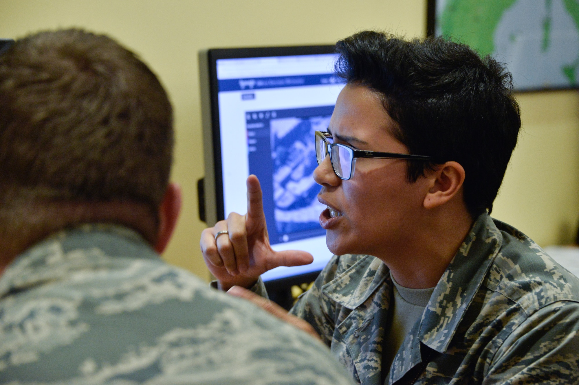 Airman 1st Class Sandra, 7th Intelligence Squadron, explains the how Project Maven works at a booth during the 70th Intelligence, Surveillance and Reconnaissance Wing’s 2018 Innovation Summit July 24, 2018 at College Park, Maryland. This was the first summit which helped bring together more than 100 Airmen from across the wing to create a culture of innovation. (U.S. Air Force photo by Staff Sgt. Alexandre Montes)