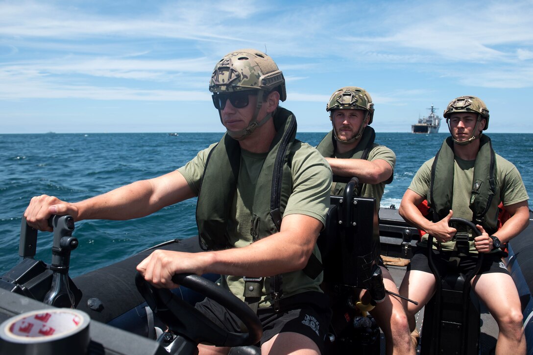 Sailors from the Netherlands pilot a rigid-hull inflatable boat.