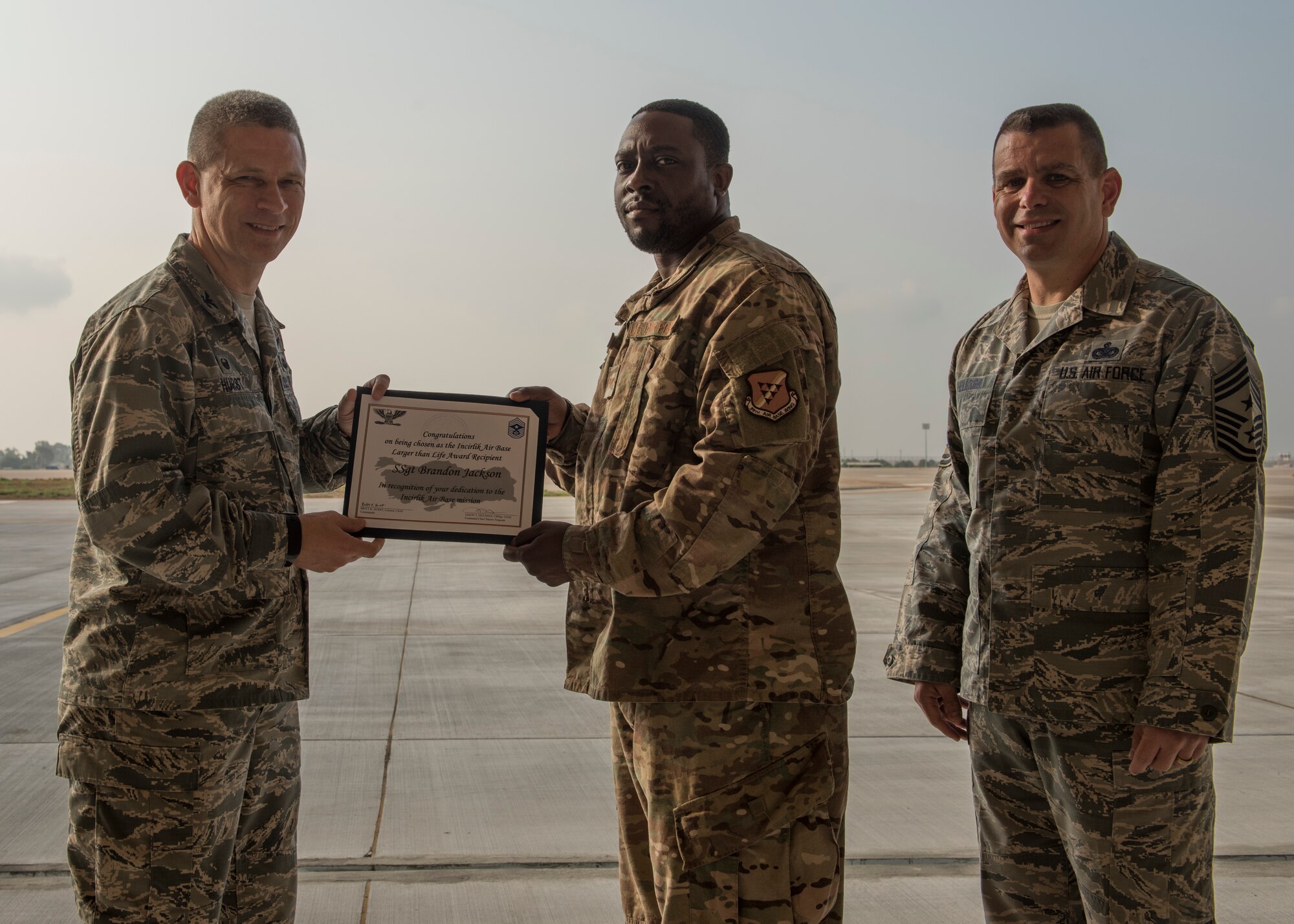 U.S. Air Force Staff Sgt. Brandon Jackson, poses with his Larger Than Life Award at Incirlik Air Base, Turkey, 2018