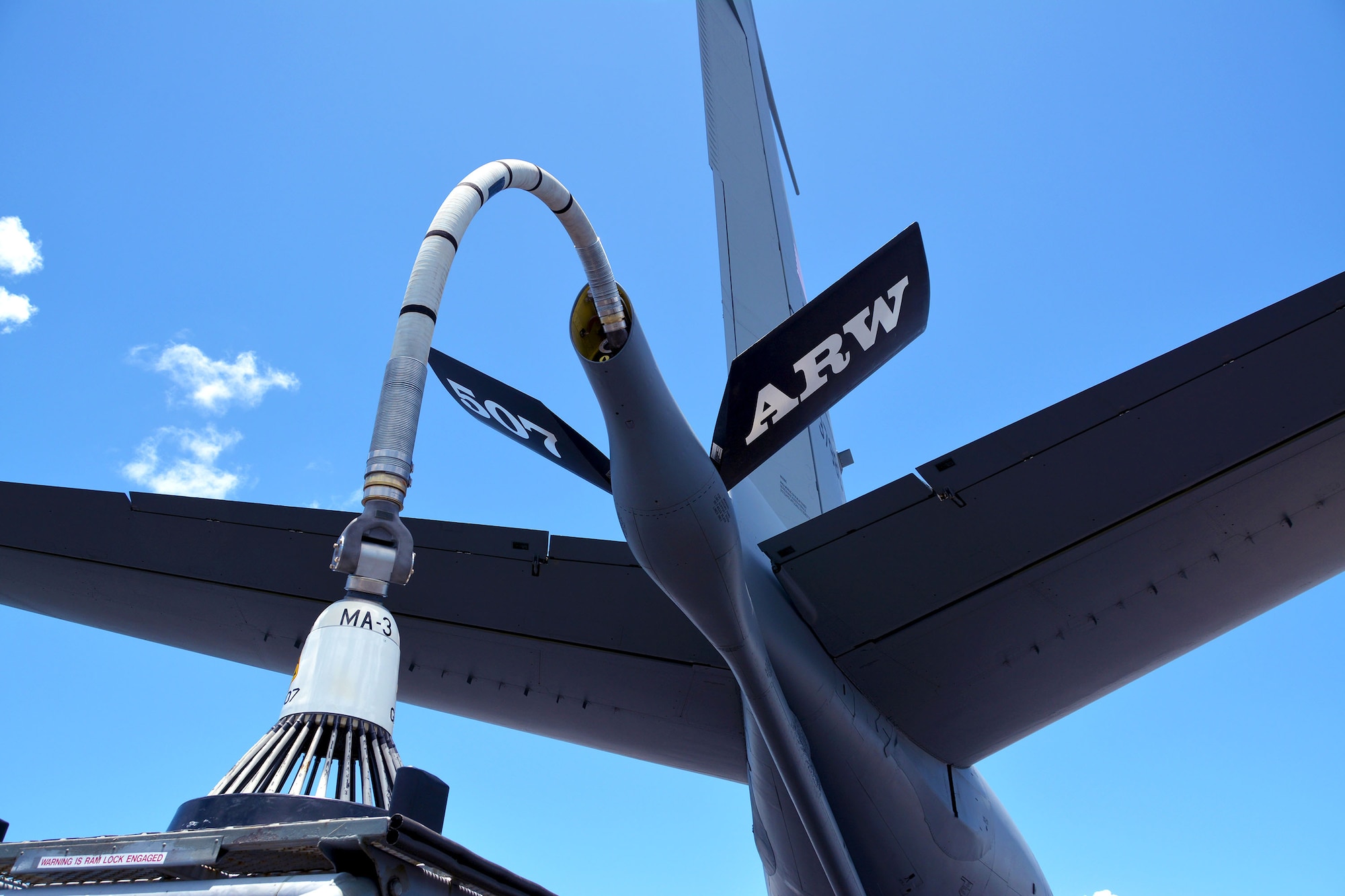 A KC-135R Stratotanker from the 507th Air Refueling Wing, Tinker Air Force Base, Oklahoma, is prepped for flight with a hose-and-drogue attached to the refueling boom July 9, in support of the Rim of the Pacific (RIMPAC) exercise. Twenty-five nations, 46 ships, five submarines, and about 200 aircraft and 25,000 personnel are participating in RIMPAC from June 27 to Aug. 2 in and around the Hawaiian Islands and Southern California. The world’s largest international maritime exercise, RIMPAC provides a unique training opportunity while fostering and sustaining cooperative relationships among participants critical to ensuring the safety of sea lanes and security of the world’s oceans. RIMPAC 2018 is the 26th exercise in the series that began in 1971. (U.S. Air Force photo by Tech. Sgt. Samantha Mathison)