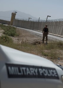 Military Police Investigator Joshua Higgins, 156th Military Police Law and Order Detachment, West Virginia Army National Guard, performs random anti-terrorism measure by checking culverts for tampering on Bagram Airfield, Afghanistan, July 28, 2018. Members of the 156th Military Police Law and Order Det. are deployed to both Bagram and Kandahar Airfields where they perform law and order operations for both installations. (U.S. Air Force photo by Tech. Sgt. Eugene Crist)