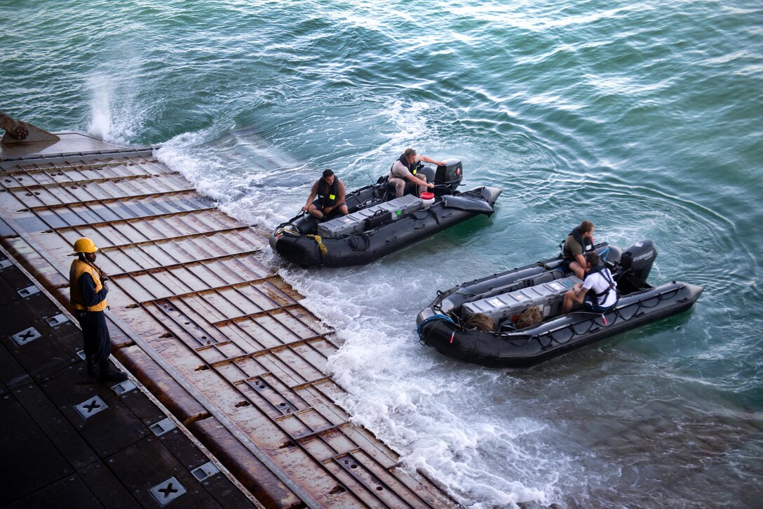 Sailors from the Netherlands launch combat rubber raiding crafts.