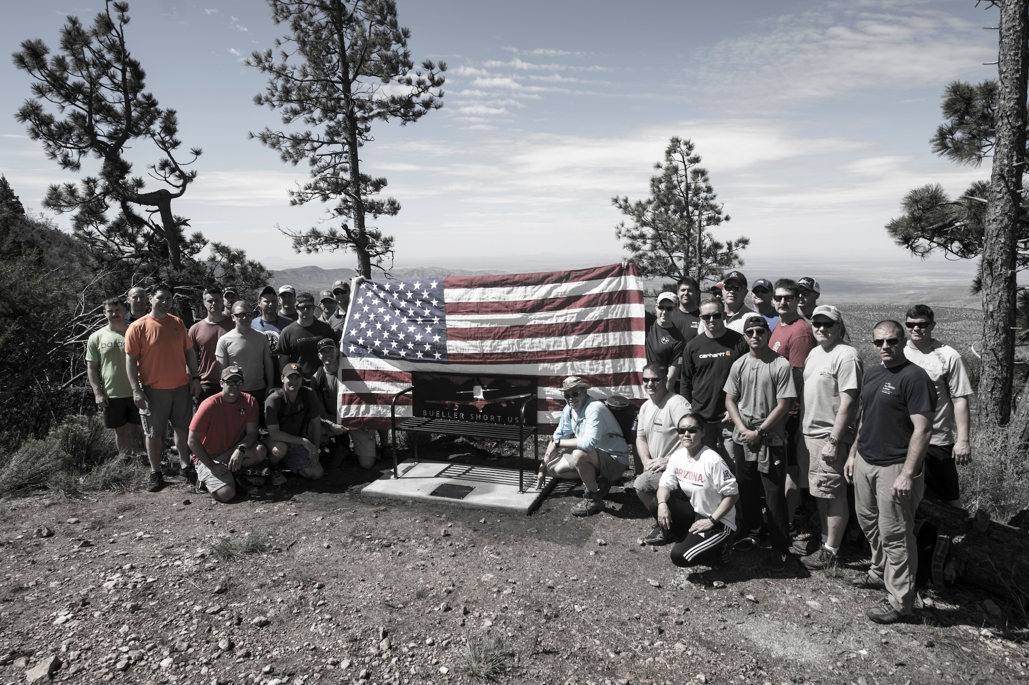 In memory of Lt. Christopher “Bueller” Short, U.S. Navy pilot, a bench was placed at the end of the Rim Trail in the Tularosa Basin, N.M., July 13, 2018. Short lost his life when an A-29 Super Tucano crashed over the Red Rio Bombing Range, June 22, 2018. (U.S. Air Force photo illustration by Senior Airman Chase Cannon)