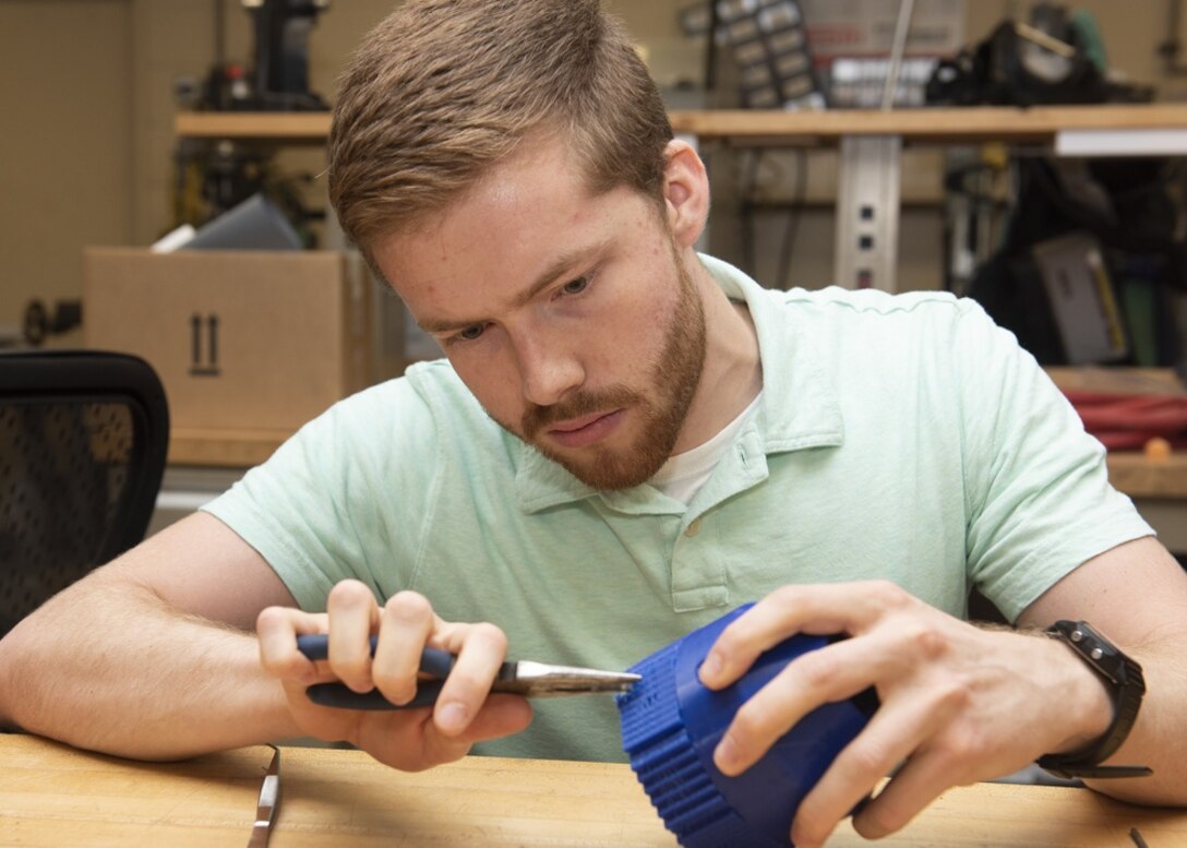 University of West Florida Mechanical Engineering Major David Holmes spent his summer as a 2018 Naval Research Enterprise Internship Program intern at Naval Surface Warfare Center Panama City Division. During his internship, Holmes worked in the development of disposable micro-unmanned under water vehicles through computer aided design and additive manufacturing. U.S. Navy photo by Ron Newsome