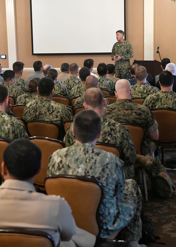 Rear Adm. Sean Buck delivers opening remarks.