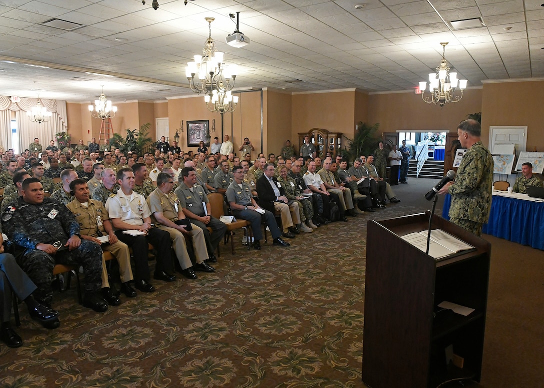 Rear Adm. Sean Buck delivers opening remarks.