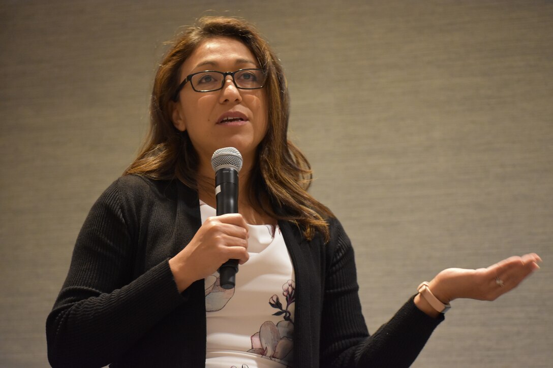 Sylvia Lopez, 88th Readiness Division Yellow Ribbon program manager, welcomes U.S. Army Reserve Soldiers and their families to the 88th RD’s Yellow Ribbon Reintegration Program event, in Schaumburg, Ill., July 22. (U.S. Army photo by Catherine Carroll/Released)