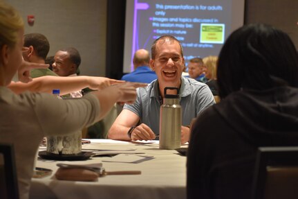 U.S. Army Reserve Soldiers and their families choose a table captain during a training session at the 88th Readiness Division’s Yellow Ribbon Reintegration Program event, in Schaumburg, Ill., July 22. (U.S. Army photo by Catherine Carroll/Released)