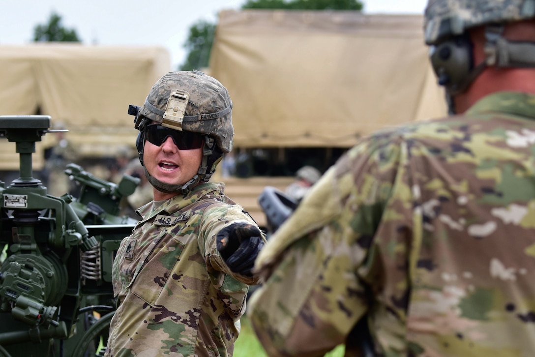 Arkansas National Guard verifies information before firing the M777A2 howitzer.