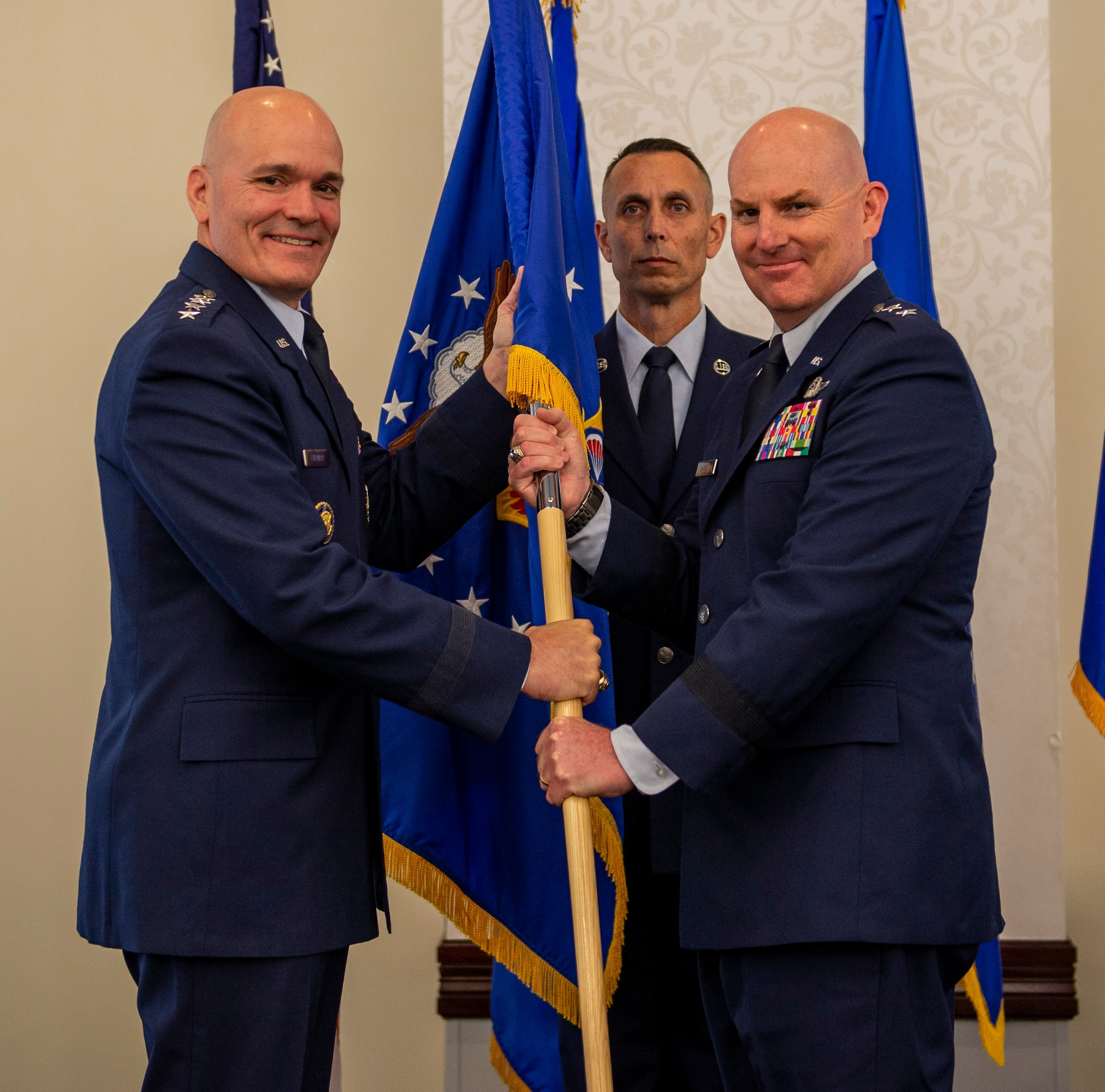 Maj. Gen. Sam Barrett takes the 18th Air Force guidon from Gen. Carlton Everhart, and assumes command of 18th AF during a ceremony July 31, at Scott Air Force Base, Ill. Barrett comes to 18 AF from his position as the Director of operations, Strategic Deterrence and Nuclear Integration, Headquarters Air Mobility Command, Scott AFB. (U.S. Air Force photo by Airman 1st Class Chad Gorecki)