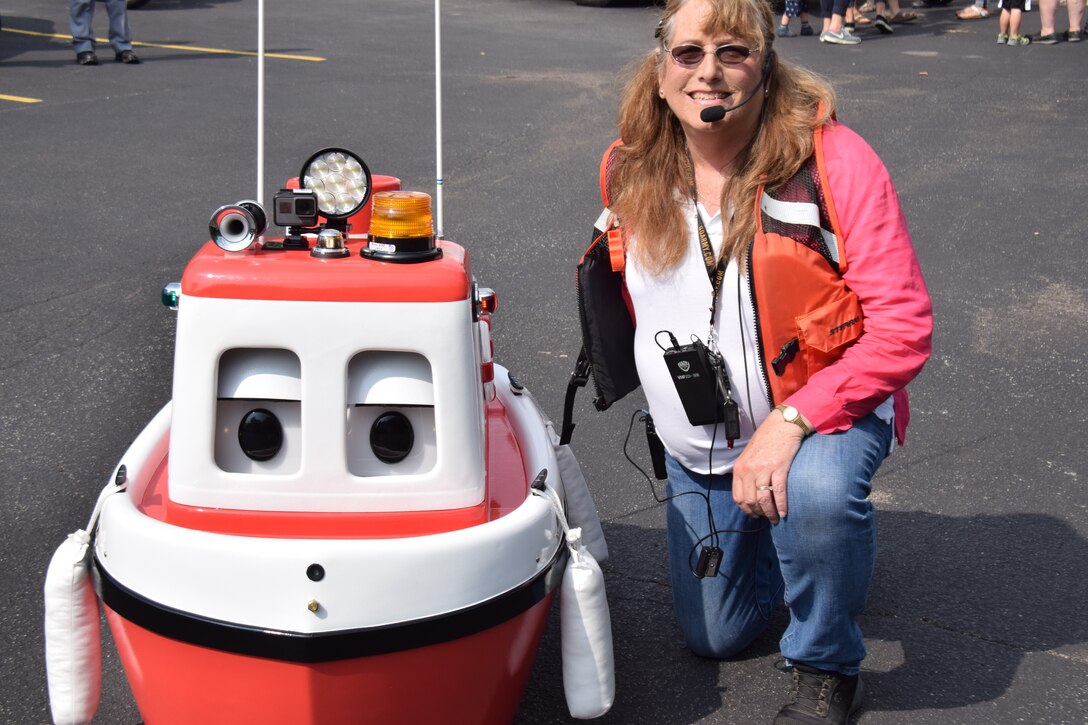U.S. Army Corps of Engineers, Buffalo District procurement technician Jean Brockner and her friend, Cory the Tugboat, visited the Bornhava school's Vehicle Day, July 26, 2018, educating kids and adults on water safety.