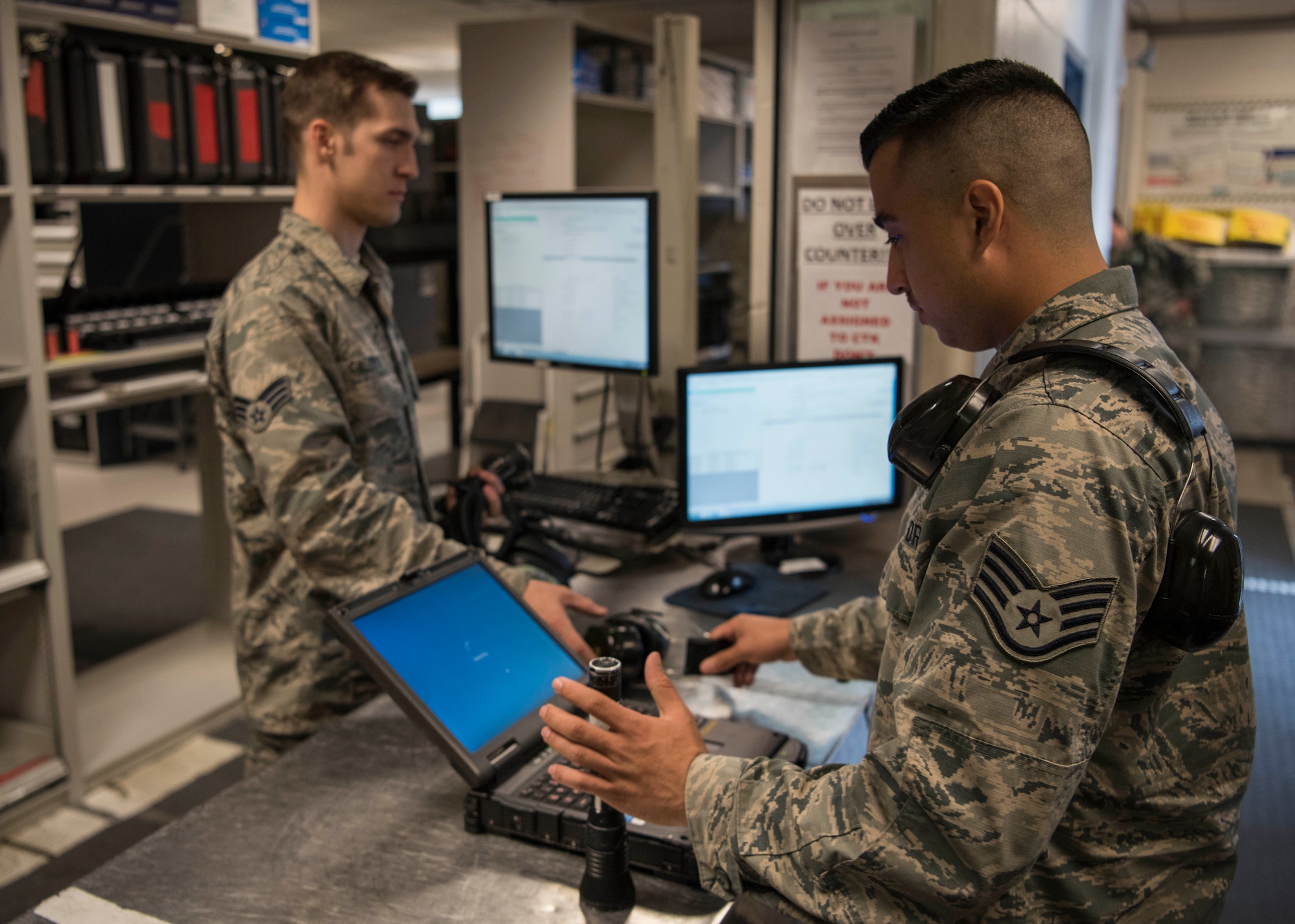 U.S. Air Force Staff Sgt. Caleb Langel, a 517th Aircraft Maintenance Unit C-17 Globemaster III dedicated crew chief, looks at a digital technical orders system during a tool and equipment shift inventory change at Joint Base Elmendorf-Richardson, Alaska, July 26, 2018. Langel is responsible and accountable for any tools he checks out while performing maintenance on the aircraft.