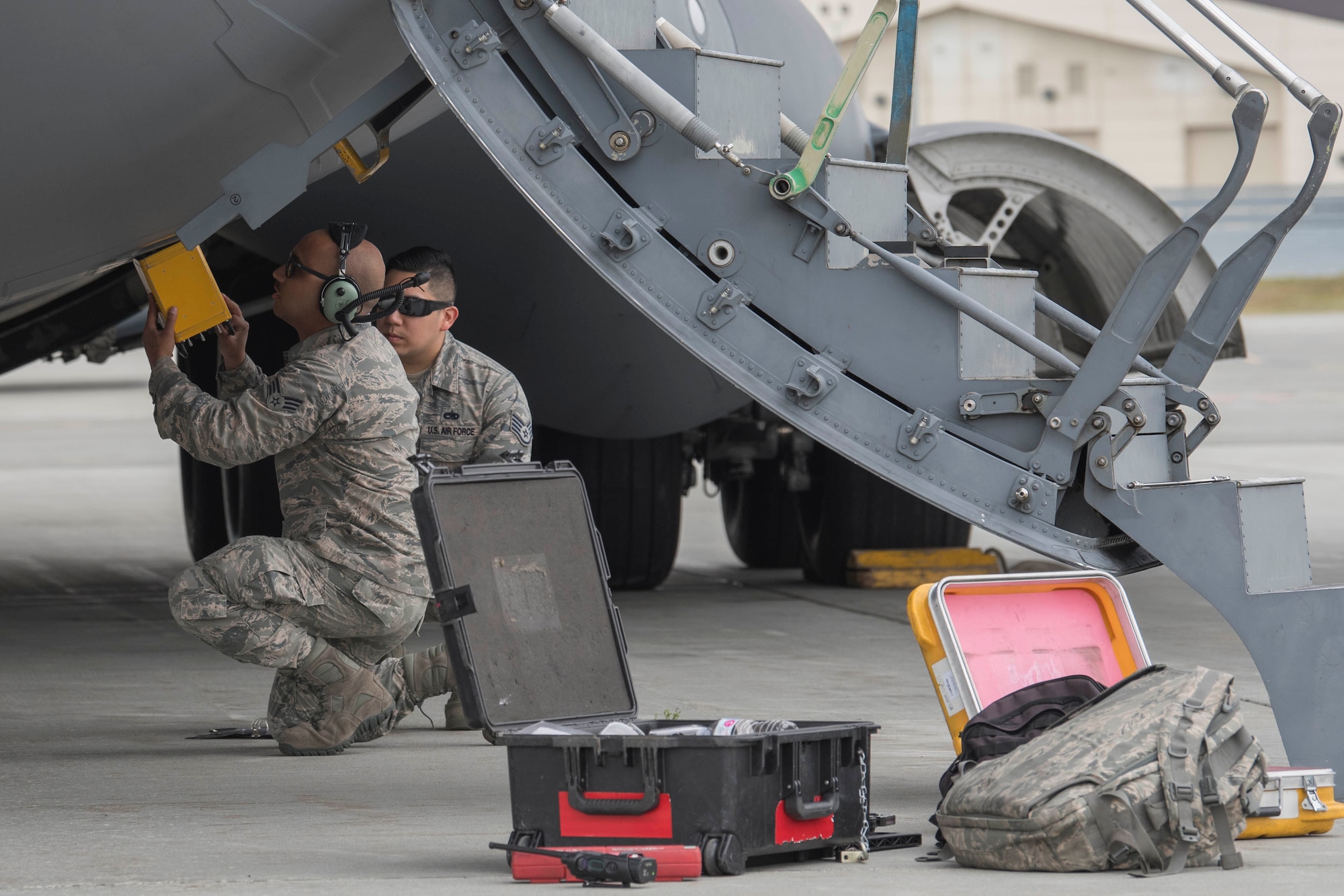 U.S. Air Force Staff Sgt. Silvestre Rojas and Senior Airman Michael Ela, both 517th Aircraft Maintenance Unit communication navigations specialists, test the counter measures dispensing system on a C-17 Globemaster III at Joint Base Elmendorf-Richardson, Alaska, July 26, 2018. During this process, the aircraft is cordoned off and the specialists test the flare dispensers for functionality.