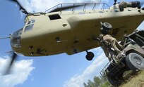 U.S. Paratroopers assigned to 2nd Battalion, 503rd Infantry Regiment, 173rd Airborne Brigade train on sling load procedures for military equipment with a CH-47F Chinook Helicopter assigned to Bravo Company, 1st Battalion, 214th Aviation Regiment, 12th Combat Aviation Brigade at the 7th Army Training Command's Grafenwoehr Training Area, Germany, July 26, 2018.