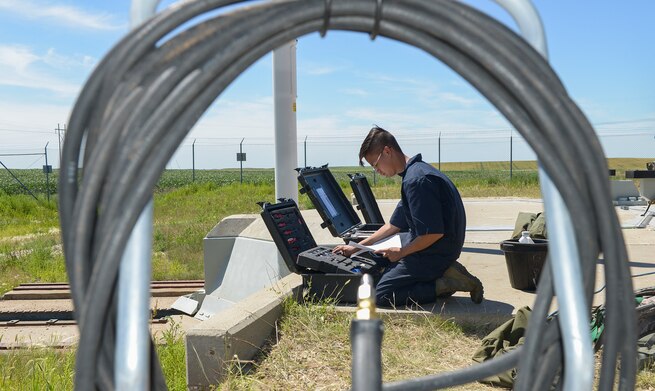 Senior Airman Randell Bowen, 91st Missile Maintenance Squadron facilities maintenance section team member, checks Senior Airman Randell Bowen, 91st Missile Maintenance Squadron facilities maintenance section team member, checks
