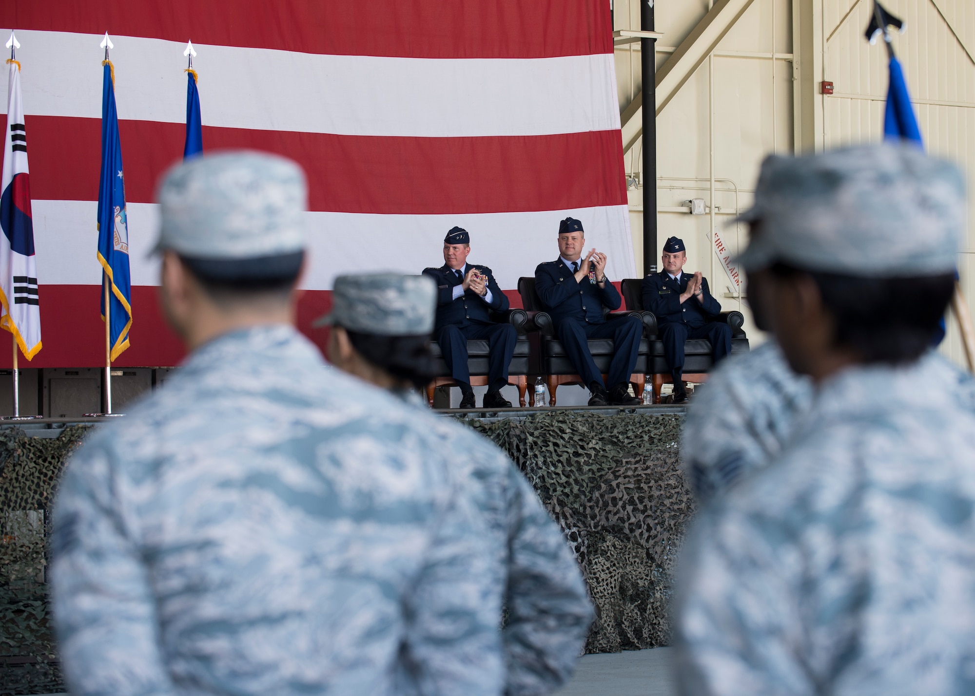 Members of the Wolf Pack stand in formation during the 8th Fighter Wing change of command ceremony at Kunsan Air Base, Republic of Korea, June 1, 2018. Col. David G. Shoemaker relinquished command to Col. John W. Bosone, making Bosone the 58th commander to take the title of “Wolf” since Gen. Robin Olds in 1967. (U.S. Air Force photo by Staff Sgt. Victoria H. Taylor)