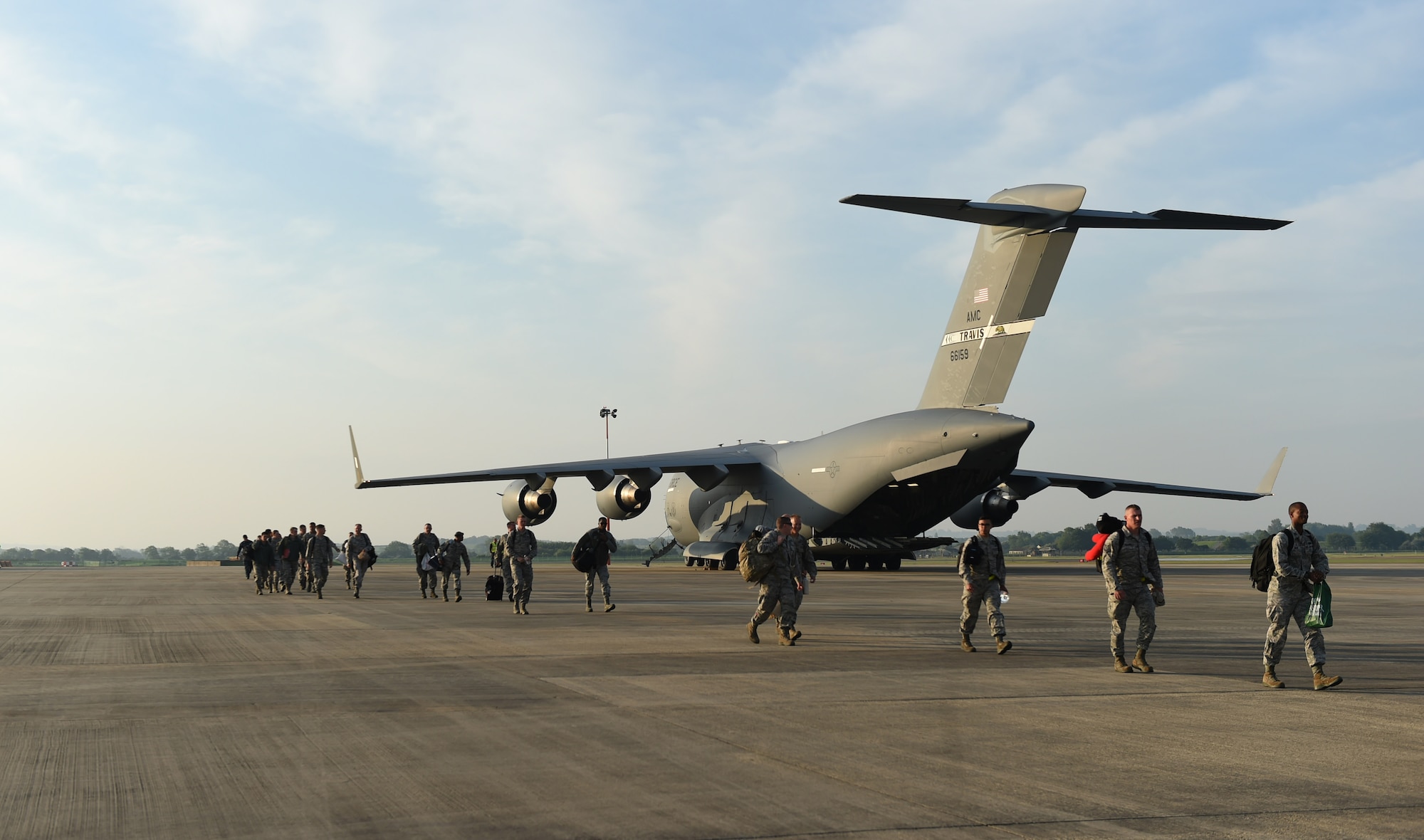 U.S. Air Force Airmen assigned to the 345th Expeditionary Bomb Squadron from Dyess Air Force Base, Texas, arrive at RAF Fairford, U.K., on a C-17 Globemaster III from Travis AFB, California, May 22, 2018. Dyess Airmen have deployed to the United Kingdom in support of NATO cross-servicing exercises which regularly include combined theater security engagements with allies and partners, demonstrating the U.S. capability to command, control and conduct bomber missions across the globe. (U.S. Air Force photo by Senior Airman Emily Copeland)