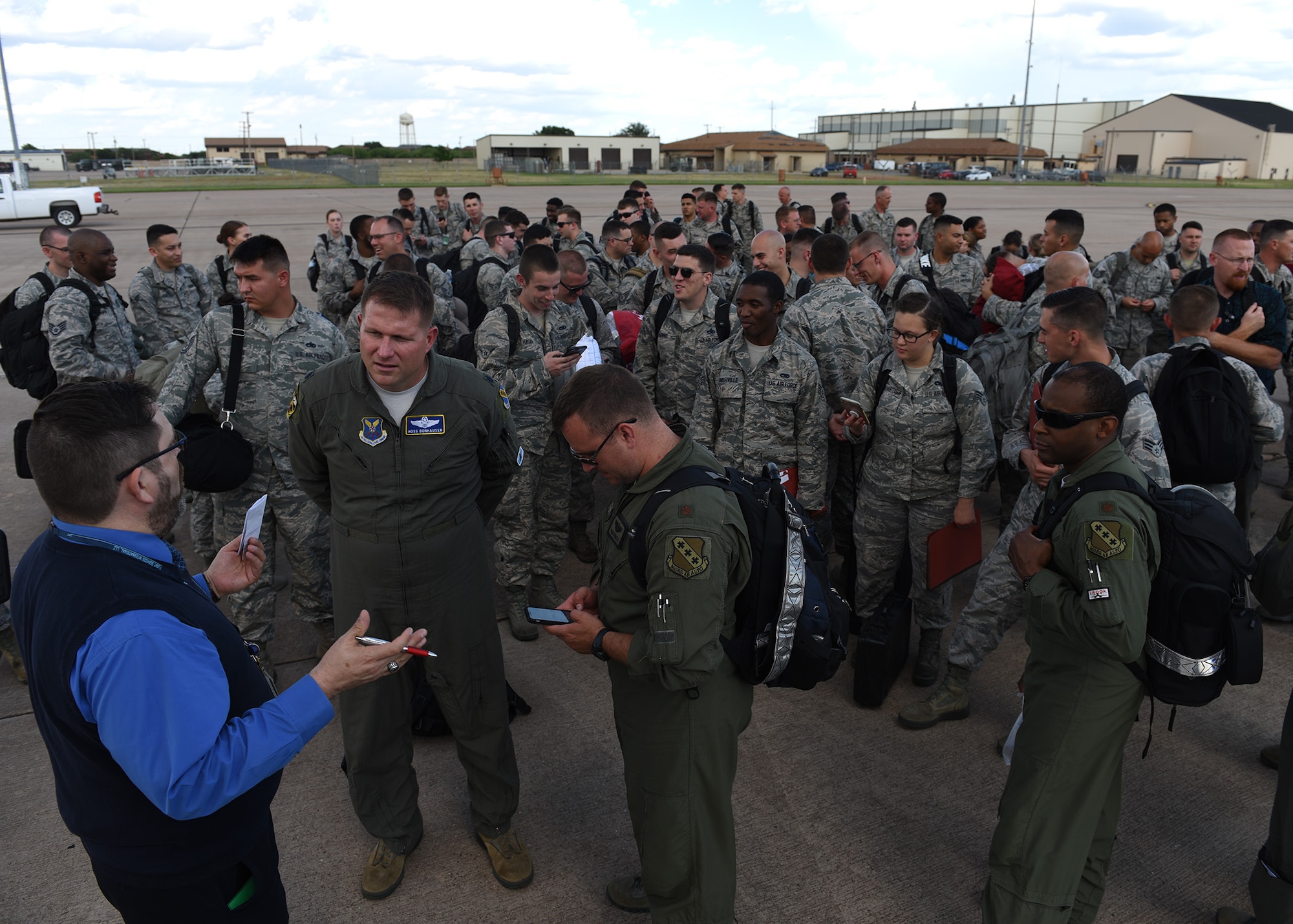 U.S. Air Force Airmen assigned to the 345th Expeditionary Bomb Squadron prepare to board a Boeing 767-375 at Dyess Air Force Base, Texas, May 24, 2018. The 345th EBS will be deployed to RAF Fairford, U.K., for several weeks in support of multiple NATO cross-servicing exercises, enhancing flexibility and interoperability among allied and partner nations. (U.S. Air Force photo by Airman 1st Class Mercedes Porter)