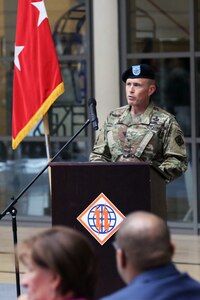 Soldier speaking at podium