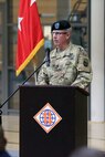 Soldier speaking at podium