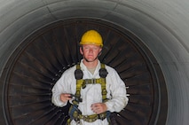 Airman 1st Class Ryan Hobbs, 380th KC-10 Crew chief, returns from completing an intake and exhaust inspection on engine 2 of a KC-10 aircraft, Al Dhafra Air Base, United Arab Emirates, May 29, 2018. Crew chiefs are responsible for maintaining the 380th Air Expeditionary Wing’s fleet of aircraft. (U.S. Air Force photo by Staff Sgt. Ross A. Whitley)