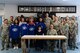 U.S. Air Force Lt. Col. Steven Brummitt, 86th Communications Squadron commander and Sarah Dorosky, 86th Mission Support Group School Liaison Officer sign an Adopt-a-School Partnership Memorandum of Understanding on Ramstein Air Base, Germany, May 31, 2018.