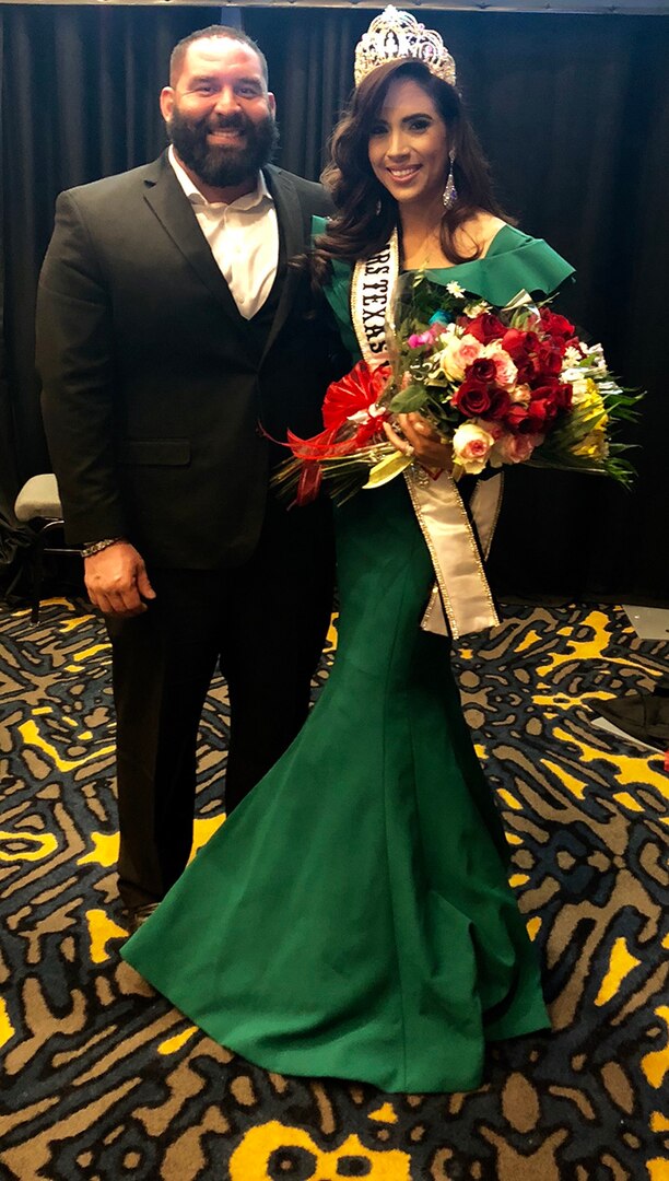 Texas Army National Guard Soldier and Mrs. Texas Galaxy, Staff Sergeant San Juanita Escobar, poses for photos with her husband after winning the Mrs. Texas Galaxy Pageant, March 10, 2018.