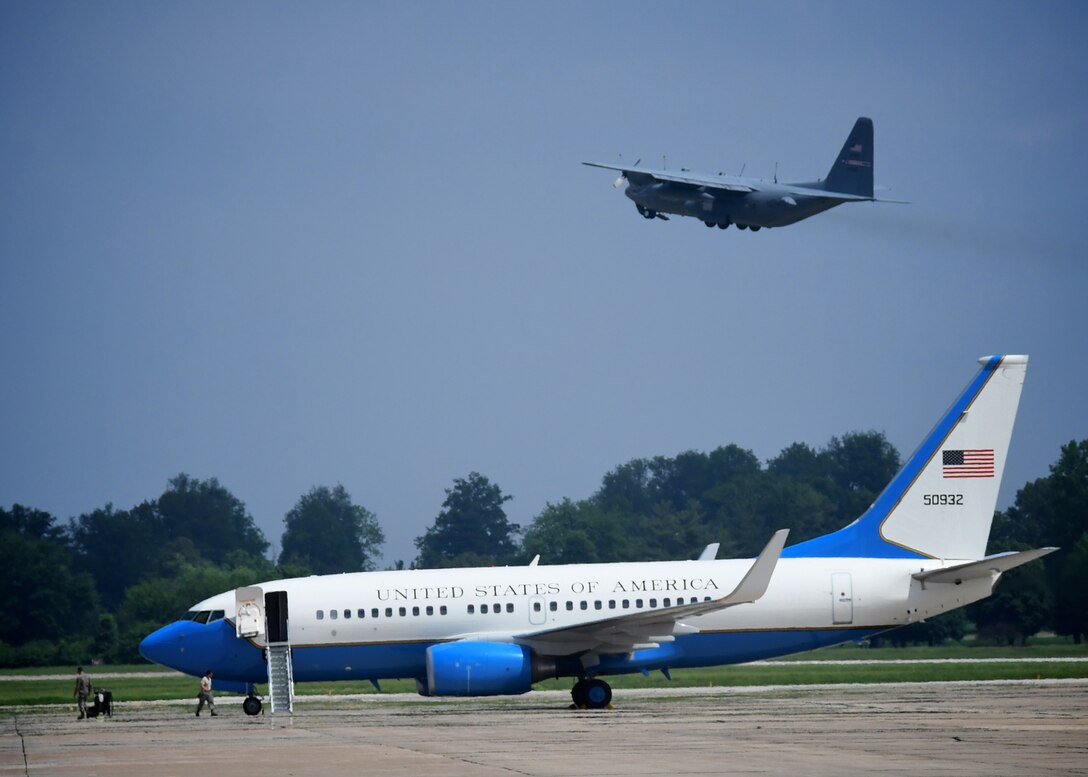 A C-130 from the 910th Airlift Wing takes off from Scott Air Force Base with a reserve crew of 932nd Airlift Wing Aeromedical Evacuation Squadron members.   They worked together with ground crew several hours prior to take off, loading medical equipment and preparing to fly with "simulated patients" during a training flight, May 19-20, 2018 at Scott Air Force Base, Ill. The AES trained alongside fellow nurses and medical technicians on a multi day flight aboard the C-130 aircraft, visiting from the 910th Airlift Wing of Youngstown, Ohio. The 932nd Airlift Wing flies the C-40 plane (in foreground), and is a 22nd Air Force unit, under the Air Force Reserve Command, and is located at Scott Air Force Base near Belleville, Ill. (U.S. Air Force photo by Lt. Col. Stan Paregien)